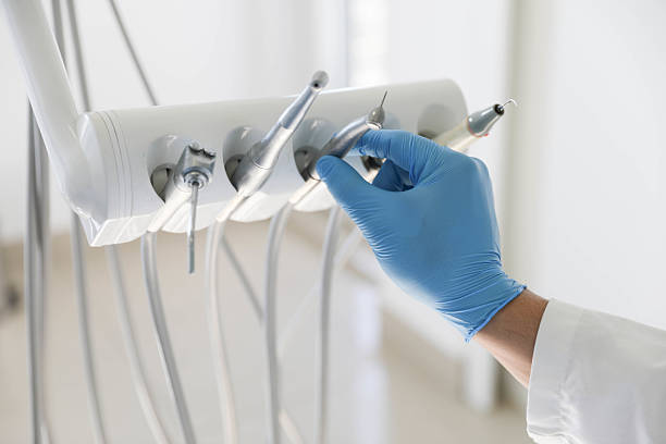 Professional Tooth Extraction technician working in Lexington, MI